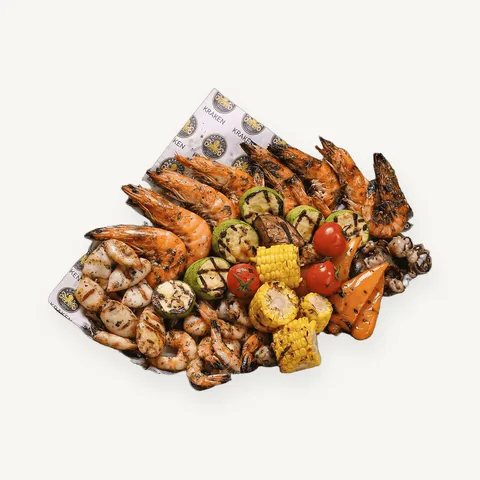 Grilled seafood platter with corn and vegetables