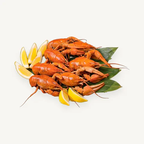 Boiled crayfish on leaves with lemon